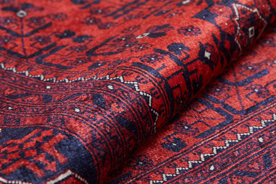 A close-up of the Regal Accents - Washable Rug - JR36 (Custom Size) in red, showcasing intricate geometric and floral patterns with a detailed border—durable and perfect for high-traffic areas.