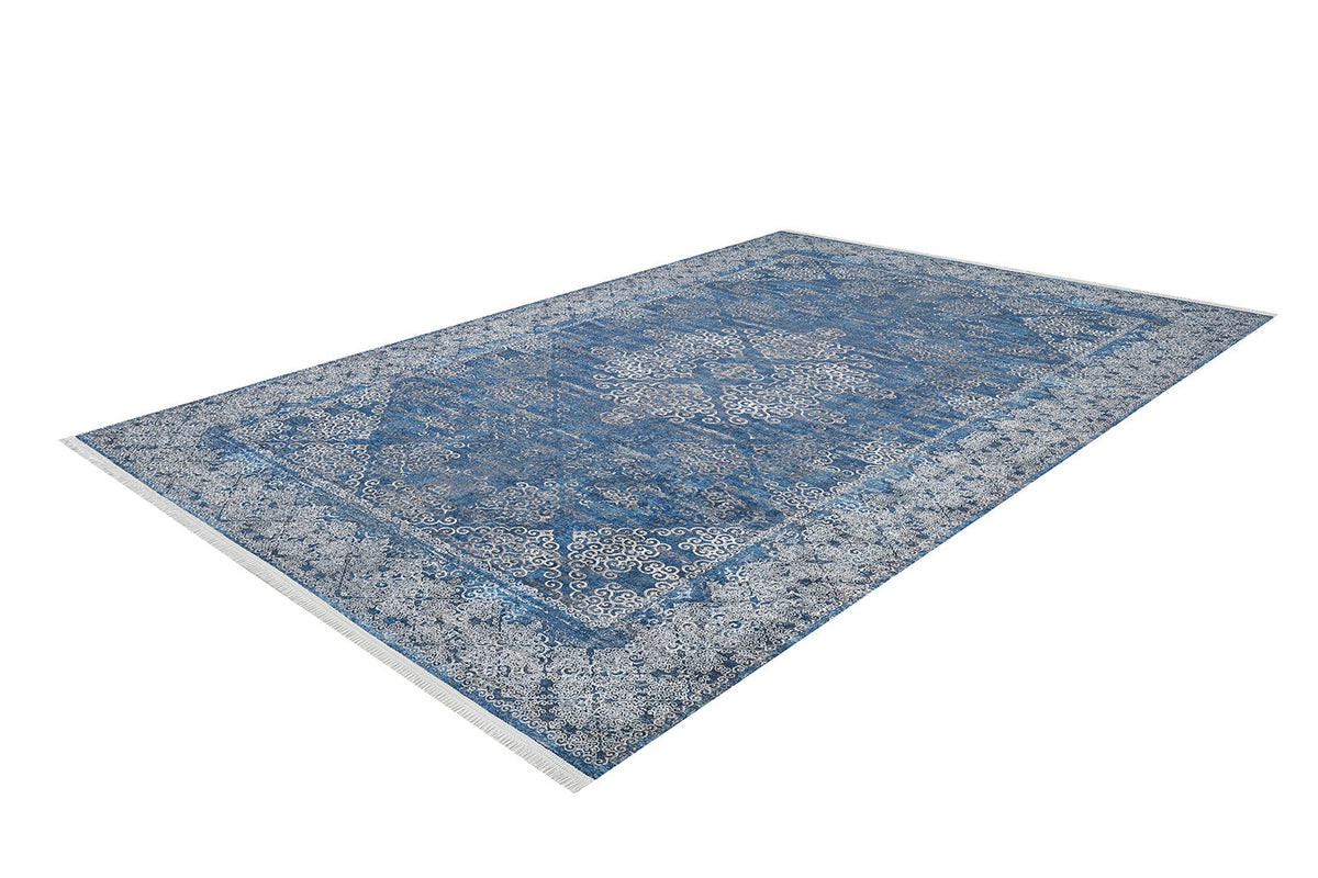 The Regal Insignia - Washable Rug - JR1786 (Custom Size) features intricate oriental-style patterns and a decorative border in blue, shown from an angled top-down view—ideal for high-traffic areas.