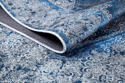 Bild 1 in Galerieansicht laden. A close-up of the Regal Insignia - Washable Rug - JR1786 (Custom Size) in blue and gray, featuring intricate swirling patterns and a textured backing—ideal for high-traffic areas.