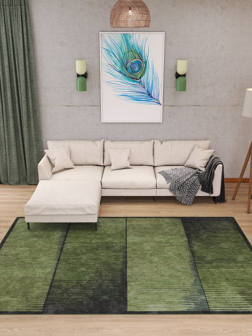 Load image 1 in gallery view. A modern living room with a beige sectional, feather wall art, green curtains, wall-mounted lights, a patterned throw blanket, and the Regal Texture - Washable Rug - JRN34 (Custom Size), perfect for high-traffic areas.
