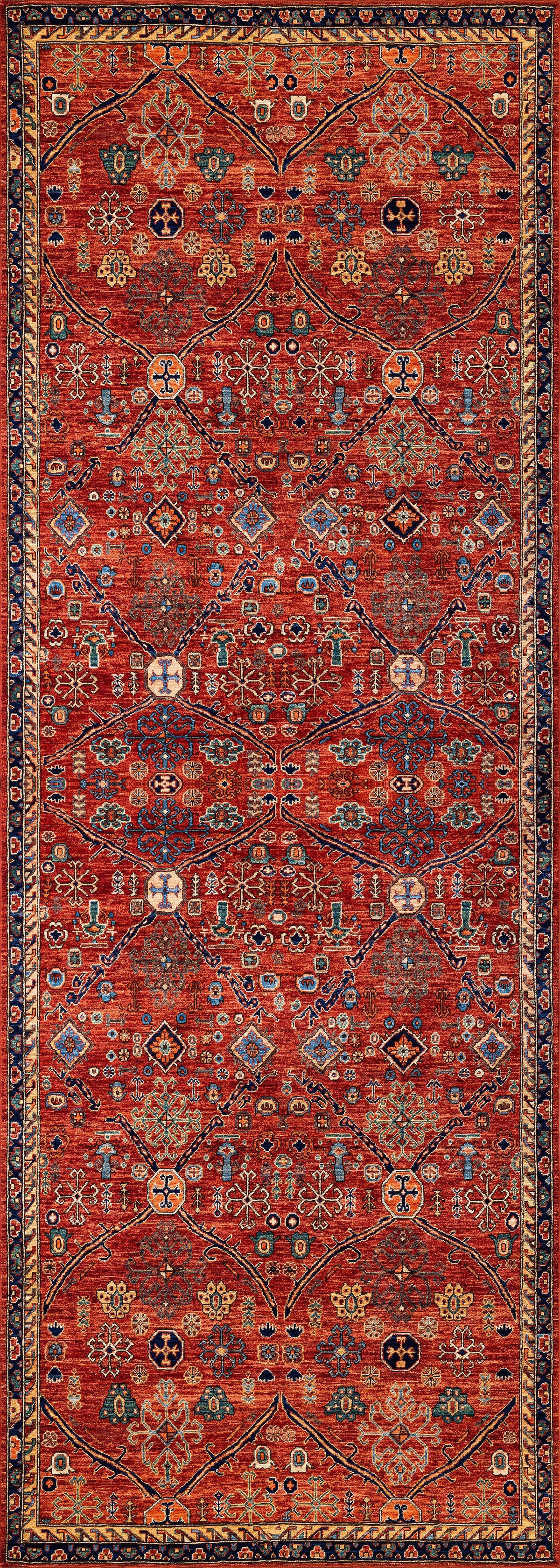 The Rhapsody Authentic Red Washable Rug - LCC3033 showcases a rich red background with geometric and floral patterns in blue, yellow, white, and black, framed by ornate multicolored borders—perfect for high-traffic areas.