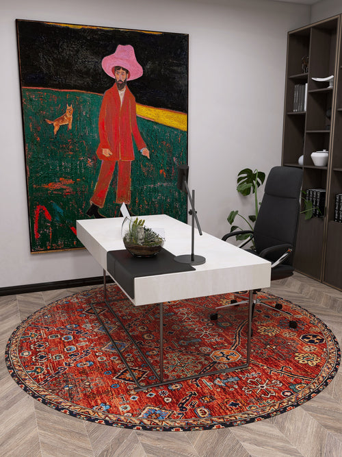 Load image 1 in gallery view. A modern office with a white desk, black chair, and the Rhapsody Authentic Red Washable Rug (LCC3033)—ideal for high-traffic spaces. A large painting of a person in a pink hat and red suit with a yellow dog on grass hangs on the wall.