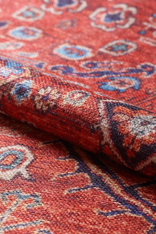 Load image 1 in gallery view. A close-up of the Rhapsody Authentic Red Washable Rug - LCC3033 (Custom Size) reveals its intricate woven designs and textured fibers in red, blue, and white—perfect for high-traffic areas and easy to clean.