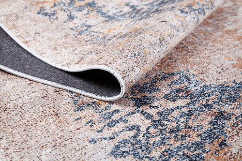 Bild 1 in Galerieansicht laden. A close-up of the Rhythmic Ripples - Washable Rug - JR1637 (Custom Size) in cream and beige with blue patterns, showing one corner folded to reveal the textured, washable underside.