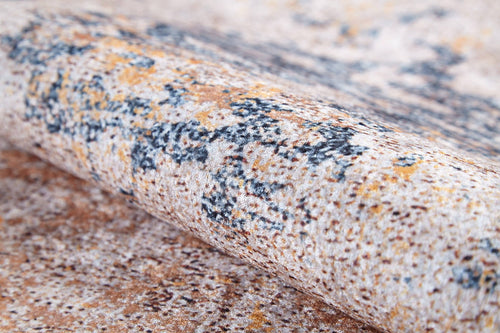 Bild 1 in Galerieansicht laden. A close-up of the Rhythmic Ripples - Washable Rug - JR1637 (Custom Size), showcasing its rolled, textured flat weave with a mottled beige, brown, orange, and dark gray pattern. Soft, dense fabric offers style and easy cleaning.