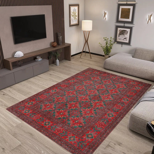 Load image 1 in gallery view. A modern living room with light wood floors, gray furniture, plants, wall art, and a Ruby Medallion - Washable Rug - JRN1031 (Custom Size) featuring a red pattern—ideal for high-traffic areas—centered in the space beneath a sleek media console and TV.