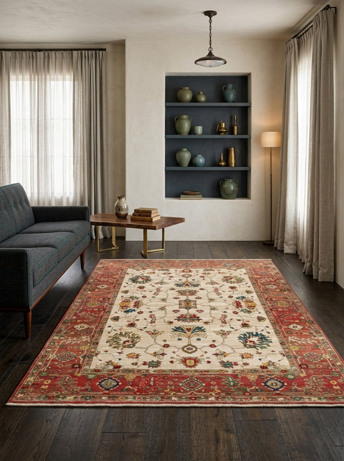 Cream and red traditional rug with a floral medallion pattern, styled in a living room with dark wood floors.