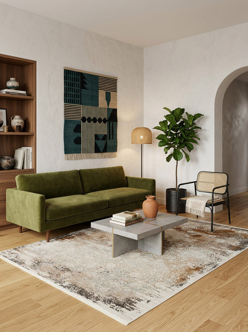 Load image 1 in gallery view. Beige and grey distressed area rug with a faded traditional pattern, styled in a modern living room.