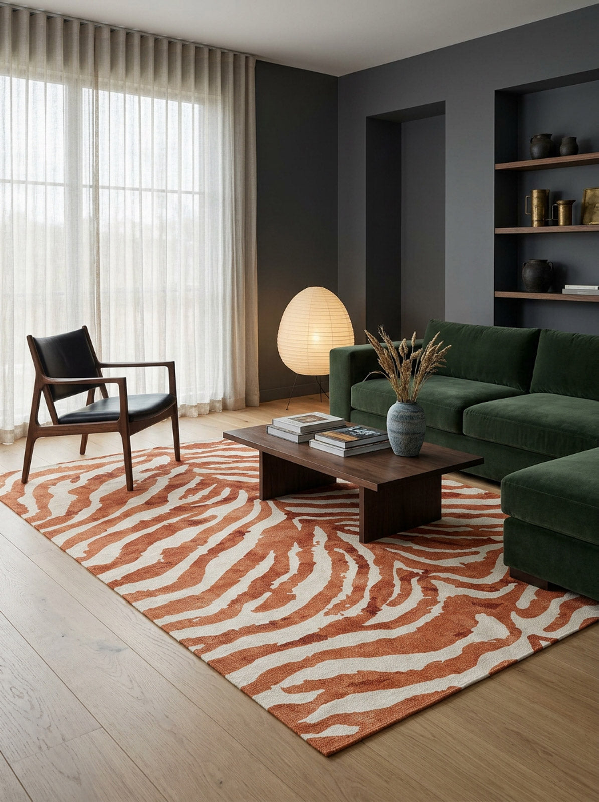 Rust and cream zebra-print rug in a modern living room with a green sofa and wood coffee table.