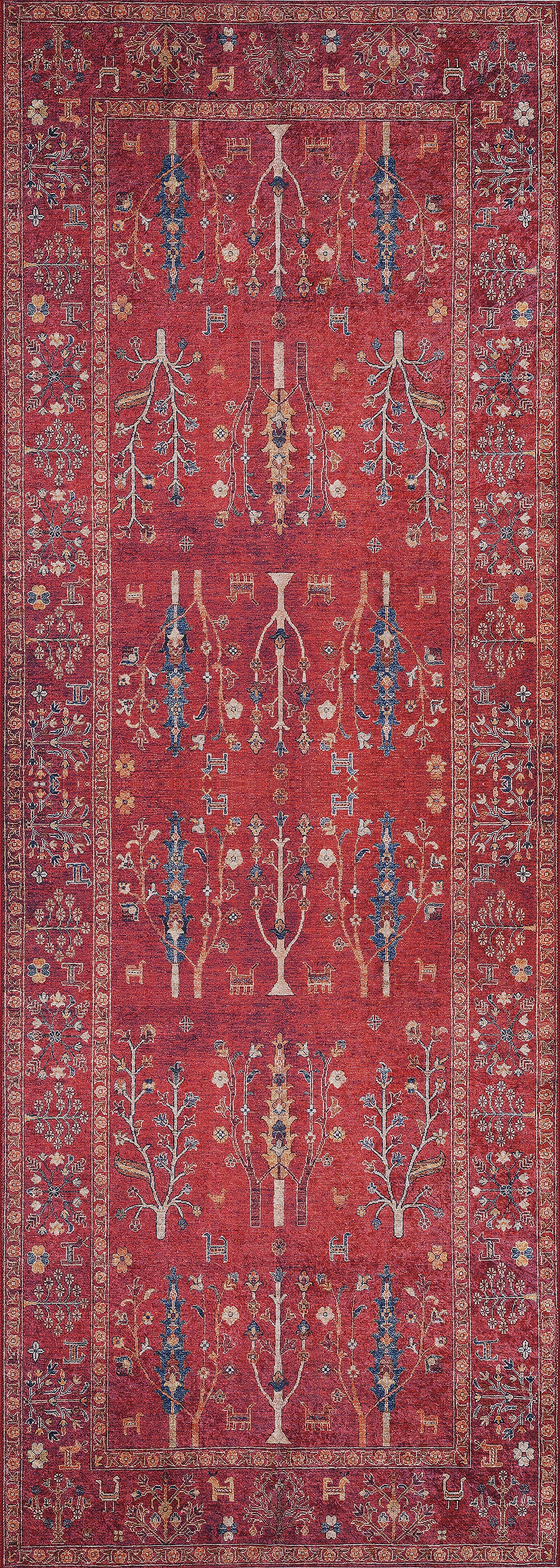 The Rustic Retreat - Washable Rug - JR5095 is a rectangular red rug with symmetrical tree, plant, and geometric patterns in blue, yellow, and cream plus a detailed border—ideal for high-traffic areas and easy to clean.