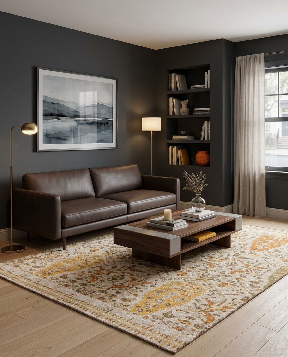 A modern living room with a dark gray accent wall, brown leather sofa, floor lamp, wall art, built-in bookshelves, wooden coffee table with decor, the Saffron Heritage Area Rug APX1912, and a large window with sheer curtains.