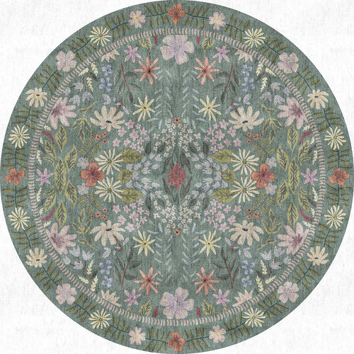 Load image 1 in gallery view. Round sage green rug featuring a symmetrical floral pattern with pink, yellow, and blue blossoms on a white background.