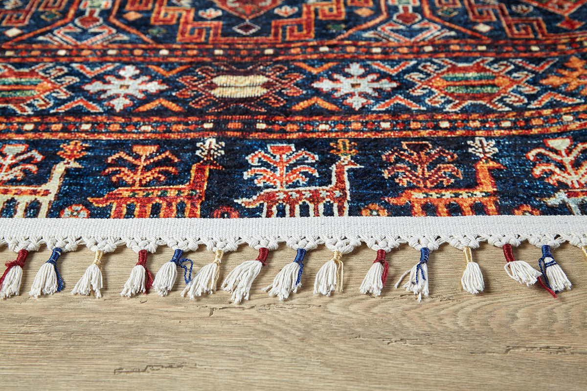 Close-up of the Sahara Sunrise - Washable Rug - JR5091 (Custom Size) featuring vibrant geometric and floral patterns, cream fringes with red and blue threads—designed for high-traffic areas on light wooden floors.