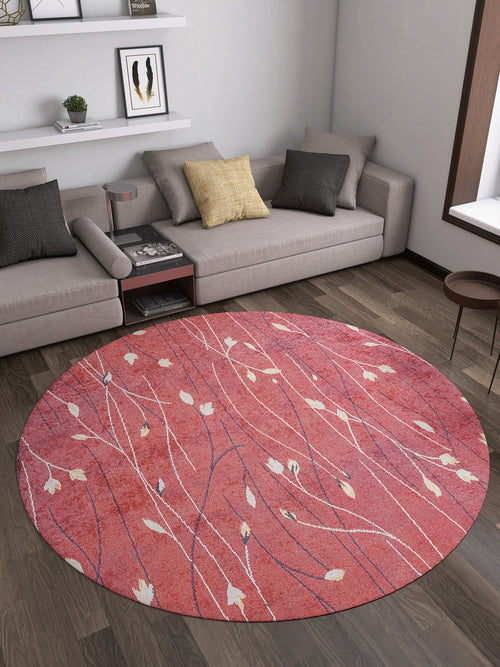 Load image 1 in gallery view. A modern living room with a gray sectional, yellow and dark pillows, wall shelves, and the Secret Garden - Washable Rug - JR1656 (Custom Size) in red leaf pattern—ideal for high-traffic areas on dark wood floors.