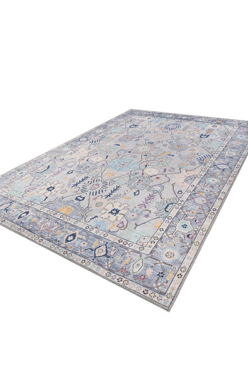 Bild 1 in Galerieansicht laden. The Seraphix Pastel Bordered Washable Rug - LCC3011 (Custom Size) features a light blue and gray background with blue, yellow, and purple floral and geometric patterns—ideal for high-traffic areas.