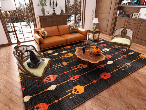 Bild 1 in Galerieansicht laden. A cozy living room features a brown sofa, two chairs, a wooden coffee table topped with a pumpkin, and the Skull Lanterns - Washable Rug - HLW005 (Custom Size), perfect for high-traffic areas. Large windows showcase a forest view.