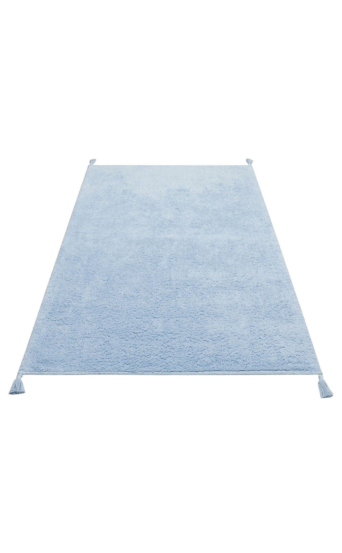The Sky Nap - Washable Shaggy - CBNPLAIN is a rectangular soft blue cotton rug with a fuzzy shaggy texture and small tassels at each corner, shown on a white background.