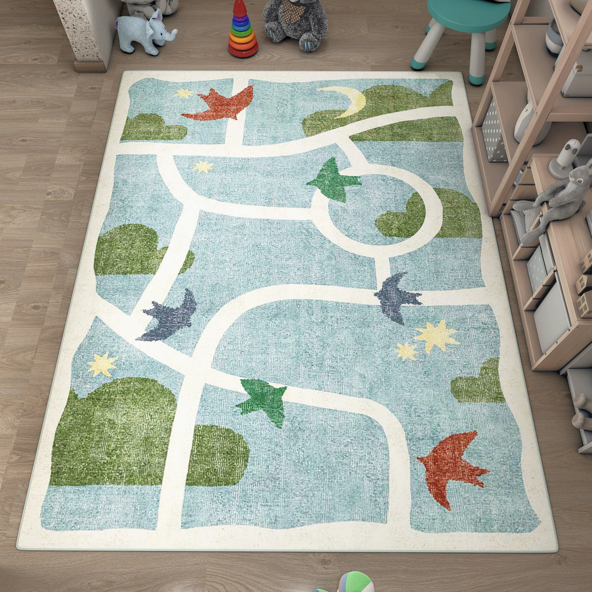 Light blue children's rug with white paths, green hills, and bird motifs, styled in a playroom.