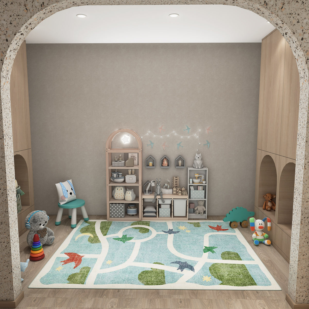 Light blue rug with a white road map pattern and green landscape accents, styled in a children's playroom.