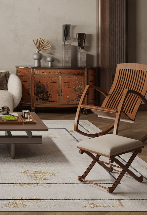 Load image 1 in gallery view. A modern living room features a beige sofa, wooden chairs, a low coffee table, and the Sleek and Contemporary - Washable Rug - JR1365 (Outlet) US in cream and beige hues, paired with an ornate red Asian-inspired sideboard.