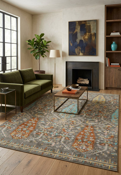 Load image 1 in gallery view. Grey traditional rug with orange and turquoise floral motifs, styled in a modern living room.