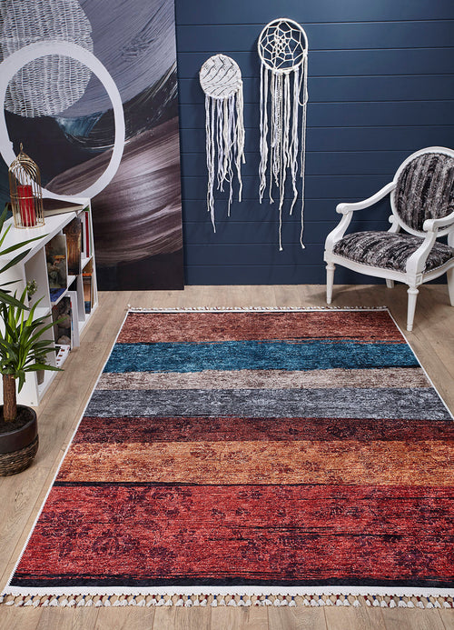 Load image 1 in gallery view. A modern living room showcases the Soft Brushed - Washable Rug - JR5056 (Custom Size), a white armchair with a patterned cushion, dreamcatchers on a dark blue wall, a white bookshelf, a potted plant, and wood floors—ideal for busy spaces.