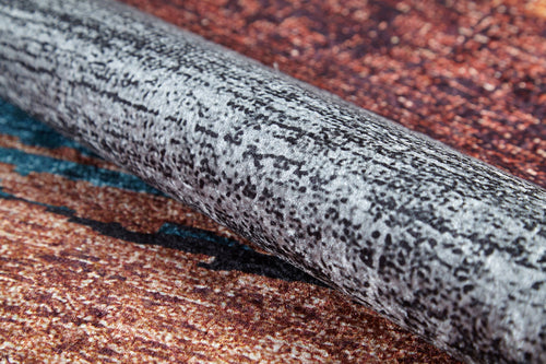 Load image 1 in gallery view. A close-up of the Soft Brushed - Washable Rug - JR5056 (Custom Size), showcasing its mottled black-and-white texture atop a reddish-brown and blue speckled surface—perfect for high-traffic areas.