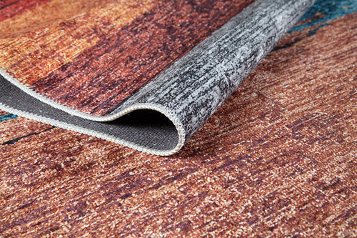 Load image 1 in gallery view. A close-up of the Soft Brushed - Washable Rug - JR5056 (Custom Size) in brown, orange, and gray tones, partially lifted to show the underside and detailed weave—ideal for high-traffic spaces.