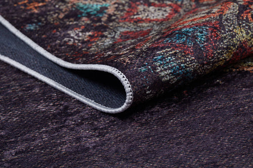 Bild 1 in Galerieansicht laden. A close-up of the Soft Haze - Washable Rug - JR1094 (Custom Size) highlights detailed edge stitching and vibrant red, blue, and green patterns—ideal for adding style to high-traffic areas on a dark background.