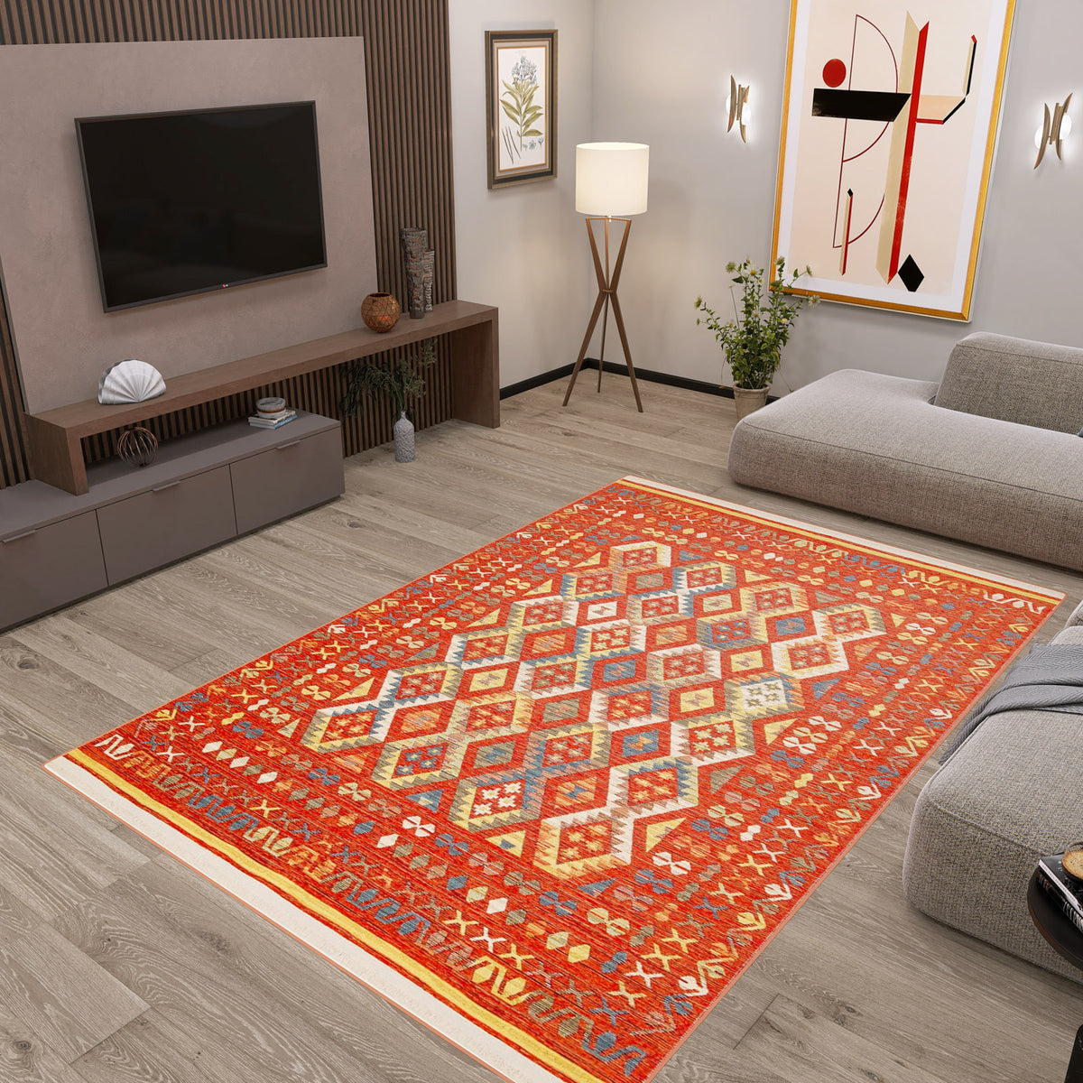 A modern living room with light wood floors, a Soft Mosaic - Washable Reversible Kilim - NMD08, gray sectional sofa, floor lamp, wall art, TV on a wooden accent wall, and a low console with decor items.
