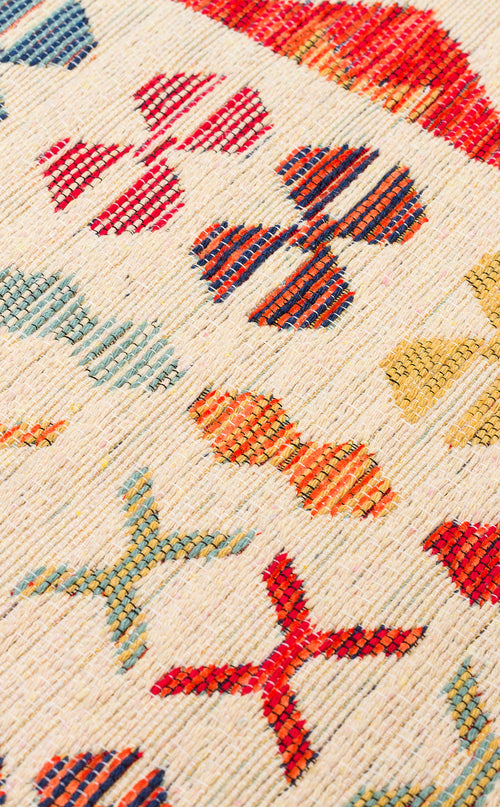 Load image 1 in gallery view. Close-up of Soft Mosaic - Kilim - NMD08 rug with a cream background, showcasing traditional geometric motifs in red, blue, yellow, and orange arranged in a repeating multicolour pattern.