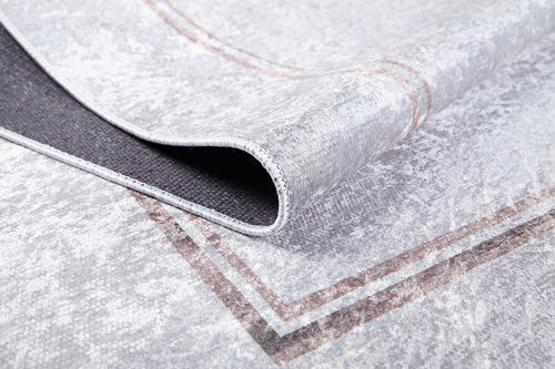 Load image 1 in gallery view. A close-up of Sophisticated Edging - Washable Rug - JR1738 (Custom Size) in light gray, featuring a brown border and dark non-slip backing—perfect for allergy-sensitive homes.