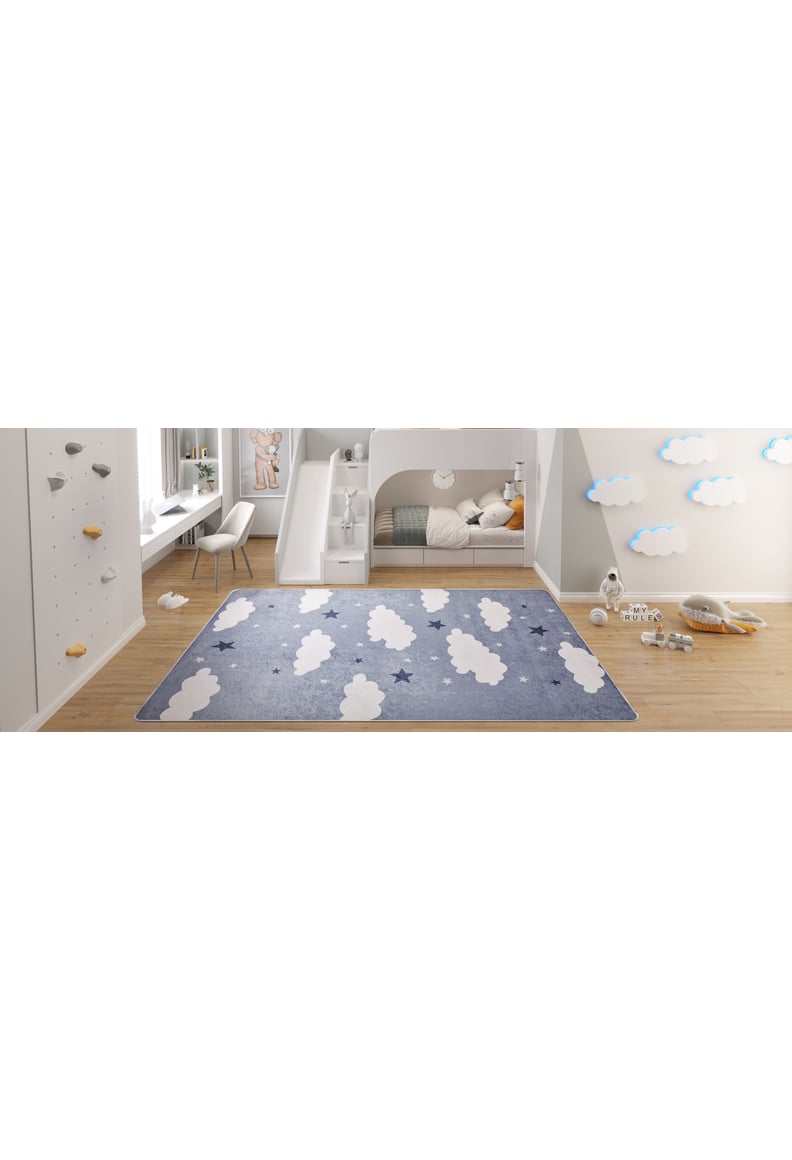 Children's bedroom with a custom-size Starry Cloudscape - Machine-Washable Rug JRC045 in blue with white clouds, bunk bed with play area underneath, cloud wall decor, toys on the floor, and a desk with chair on the left.