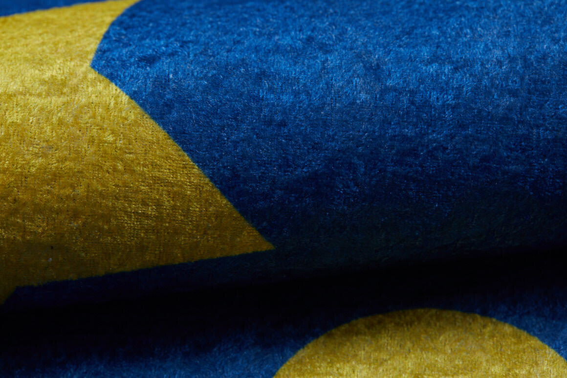 Close-up of the Starry Dreams - Machine-Washable Rug JRC004 (Custom Size), showing its blue flat weave with a yellow star and circle motif inspired by the European Union flag.