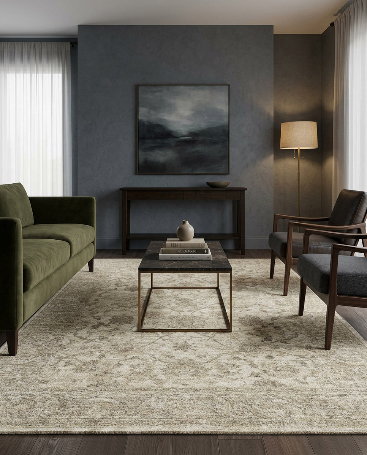 Modern living room with a green sofa, two dark armchairs, a black coffee table, the Stone Garden Area Rug APX1961, console table, floor lamp, and landscape painting on a gray wall. Light streams in from a curtained window.