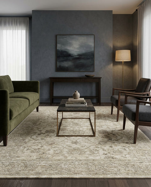 Load image 1 in gallery view. Modern living room with a green sofa, two dark armchairs, a black coffee table, the Stone Garden Area Rug APX1961, console table, floor lamp, and landscape painting on a gray wall. Light streams in from a curtained window.