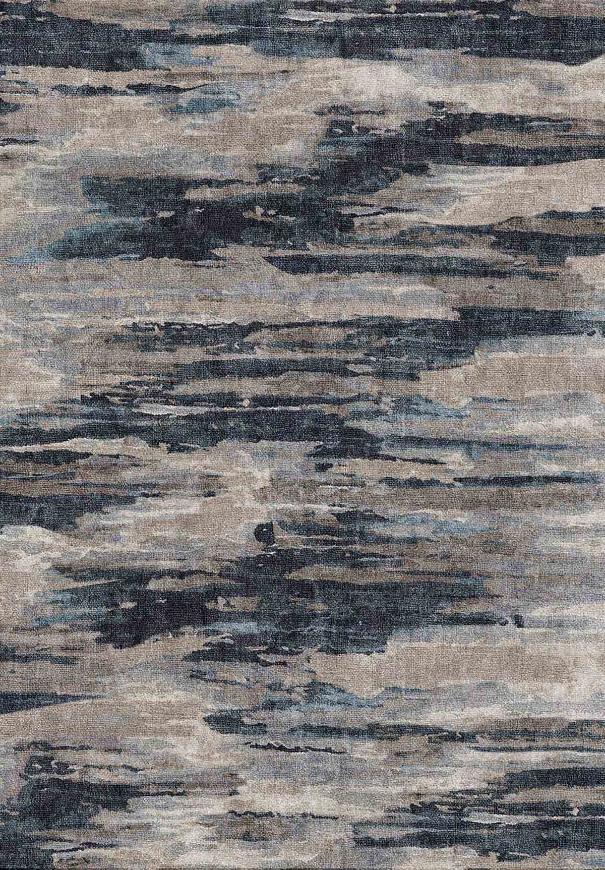 Abstract rug with horizontal, distressed layers in shades of navy blue, charcoal, and light gray.
