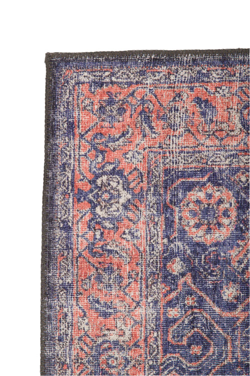 Bild 1 in Galerieansicht laden. A close-up of the Stormstripe Echo - Washable Rug (JR0046) highlights its intricate floral patterns in navy blue, coral, and white tones, accented by a dark border and detailed decorative designs, all in a washable format.