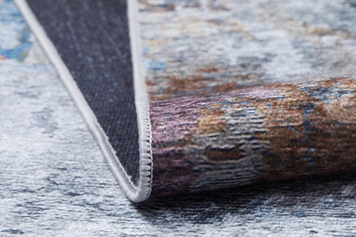 Load image 1 in gallery view. A close-up of the Striking Statements - Washable Rug - JR786 (Custom Size) showcases its textured surface, abstract multicolor pattern, folded corner, and crisp white edging.