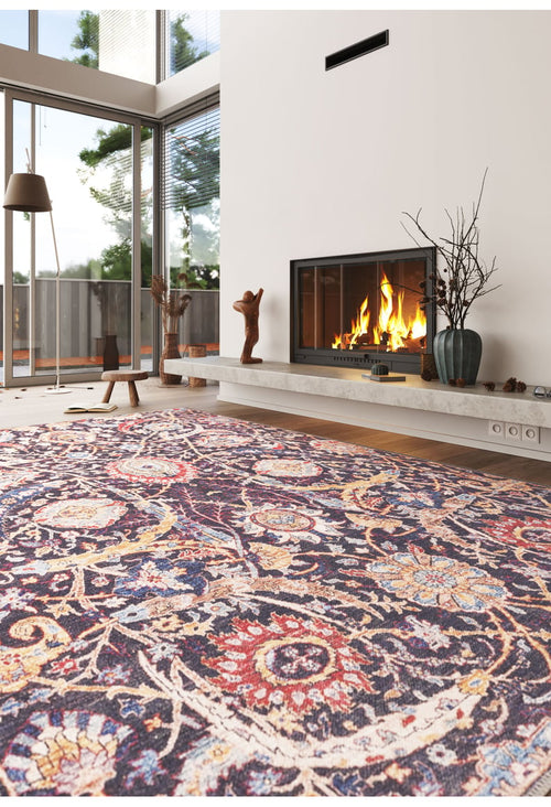 Load image 1 in gallery view. A cozy modern living room with the Sylvanor Colorful Washable Rug - LCC3017, a bright-fire fireplace, minimalist décor, and large windows with views of trees and a patio—ideal for high-traffic spaces.