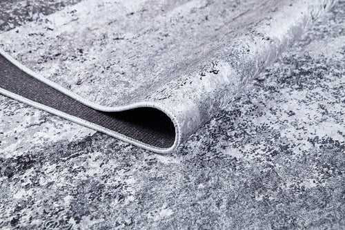 Load image 1 in gallery view. A close-up of the Techno Flux - Washable Rug - JR1814 (Custom Size) in gray-anthracite shows its modern abstract pattern, thin edge trim, and dark non-slip backing—perfect for high-traffic areas.