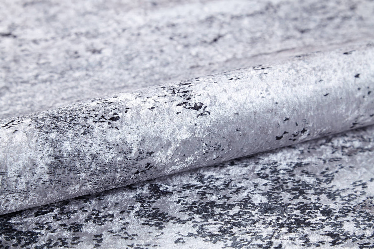 A close-up of the Techno Flux - Washable Rug - JR1814 (Custom Size), featuring a marbled silver and gray pattern—ideal for high-traffic spaces that want a sophisticated, modern touch.
