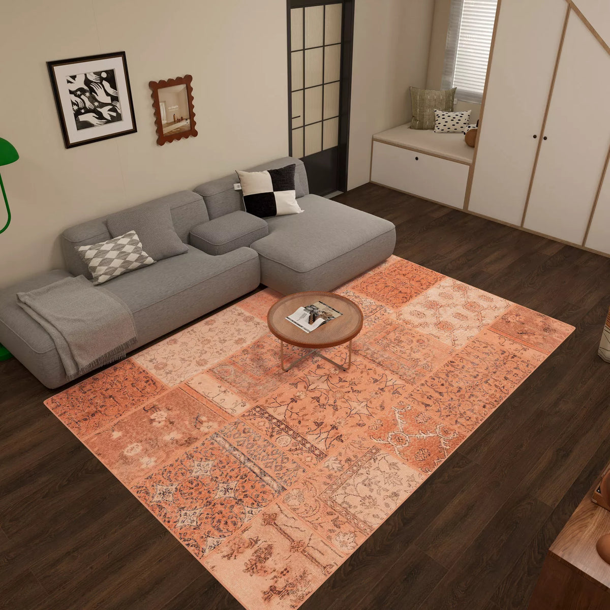 A cozy living room features a gray sectional sofa, round wooden coffee table, and the Terracotta Patch - Washable Rug - JRN1037 (Custom Size) on dark wood flooring. Modern pillows and décor create an inviting feel with this easy-care rug as the centerpiece.