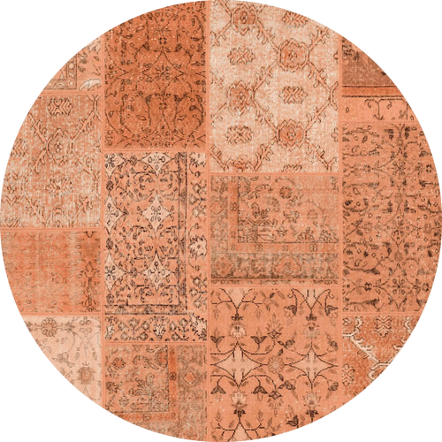 Load image 1 in gallery view. The Terracotta Patch - Washable Rug (JRN1037) is a round, flat weave rug in custom sizes, showcasing a patchwork design with orange and terracotta shades and detailed floral and geometric patterns in each section.