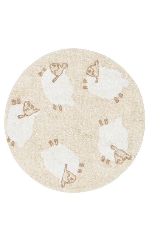 Load image 1 in gallery view. The Tiny Motion - Washable Shaggy - CBN11 is a round beige cotton shag rug with five white sheep, each outlined in light brown and facing different directions. The shaggy rug is washable for easy maintenance.