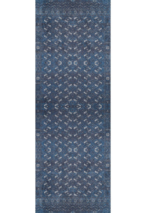 Load image 1 in gallery view. The Tribal Trail - Washable Rug - JR1939 is a rectangular blue rug with an intricate symmetrical pattern of white and light blue floral motifs, plus detailed borders—ideal for adding traditional elegance to high-traffic spaces.