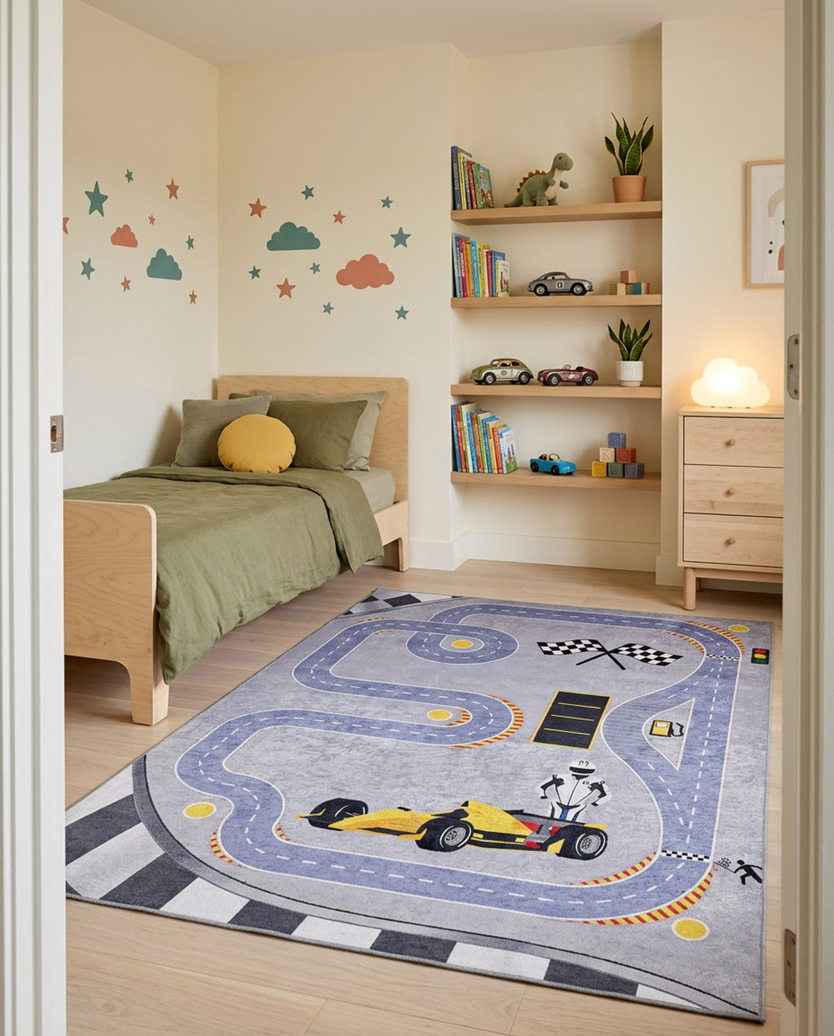 Grey rug with a race track pattern, yellow formula car, and checkered flags, styled in a child's bedroom.
