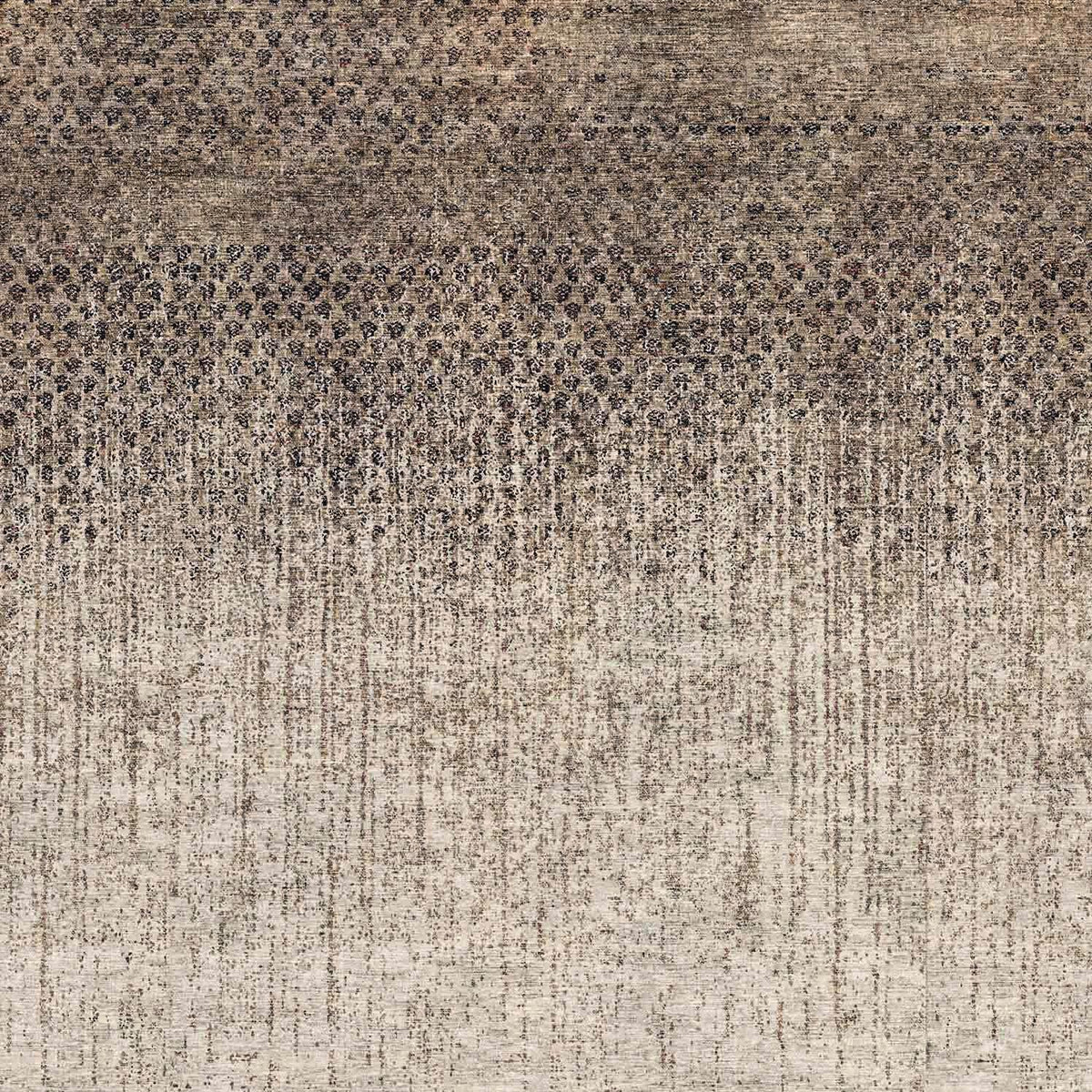 Brown and beige rug with a dark, dense geometric pattern at the top fading into a vertical, distressed texture.