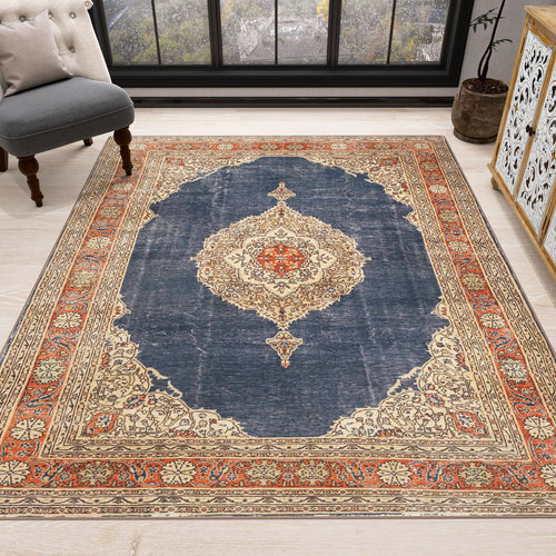 Load image 1 in gallery view. The Antique Symphony - Washable Rug - JRN1017 features a dark blue center, ornate cream and red medallion, and intricate beige, red, and blue borders—ideal for traditional interiors with light wood floors by a window.