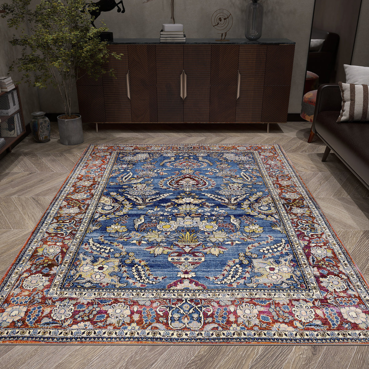 Blue and red traditional Persian-style rug with floral motifs, styled in a modern living room.